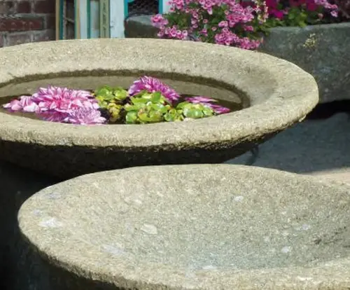 Product image of the product “Bowl model „Lotus“, bossed outer surface, 100x100x30 cm  Natural stone (Basanit), ”